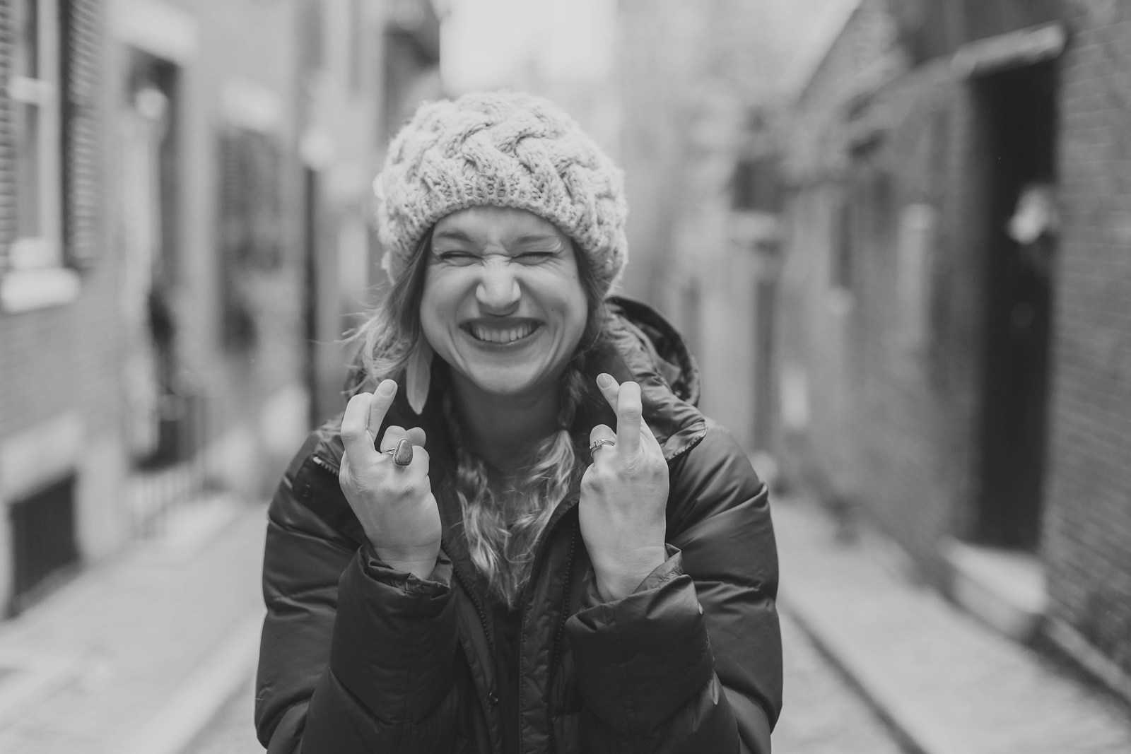 woman in black leather jacket smiling